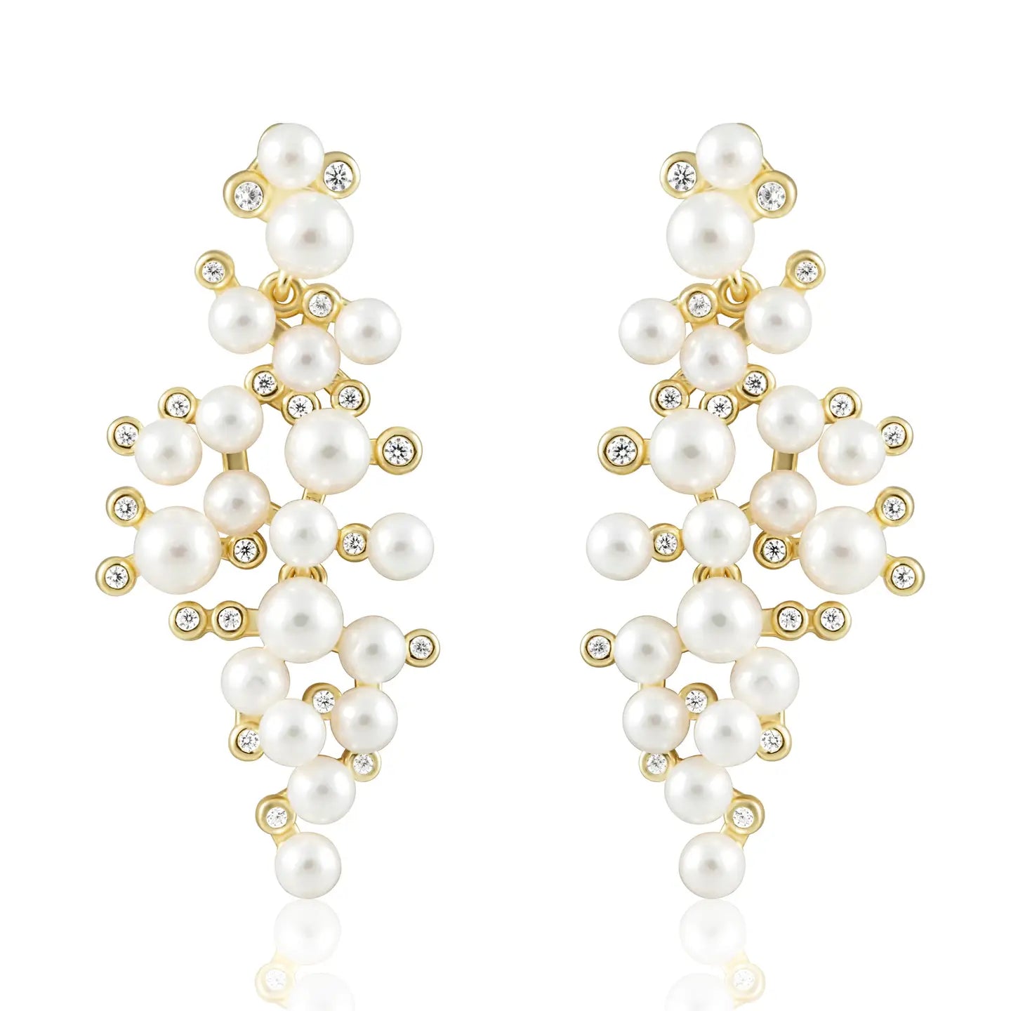 Pearl earrings with gold accents on a white background